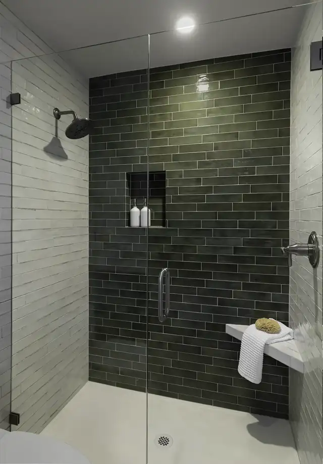 Lake Stevens, WA ensuite shower with dark green subway tile, recessed niche, fold-down bench and frameless glass