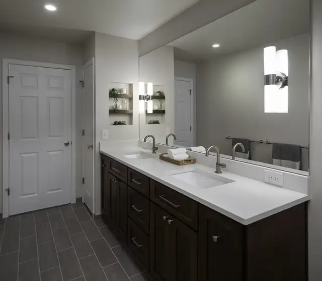 Hall guest bathroom remodel in Lake Stevens, WA with an espresso double vanity, white quartz top and slate-look floor
